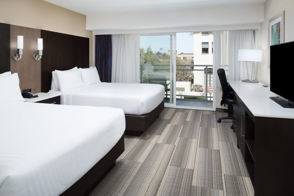 Standard Room, 2 Queen Beds, Balcony | Pillowtop beds, in-room safe, desk, blackout drapes