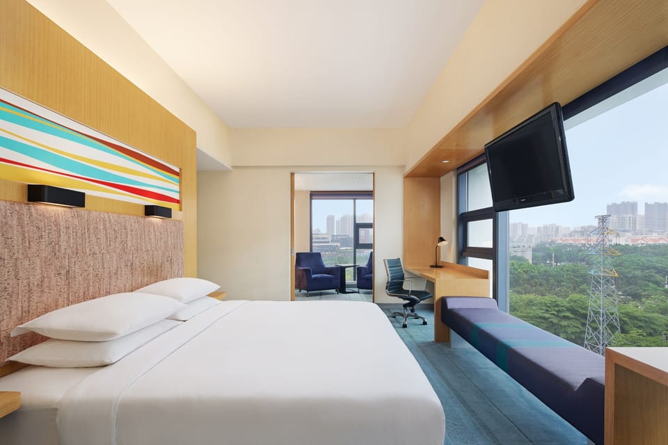 Studio, 1 King Bed, City View | 1 bedroom, minibar, in-room safe, desk
