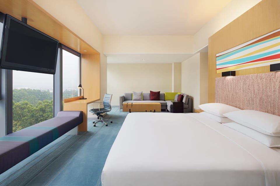 Studio, 1 King Bed, City View | 1 bedroom, minibar, in-room safe, desk