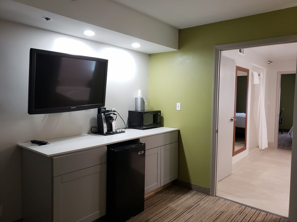 Suite, 1 Bedroom | Living area | TV