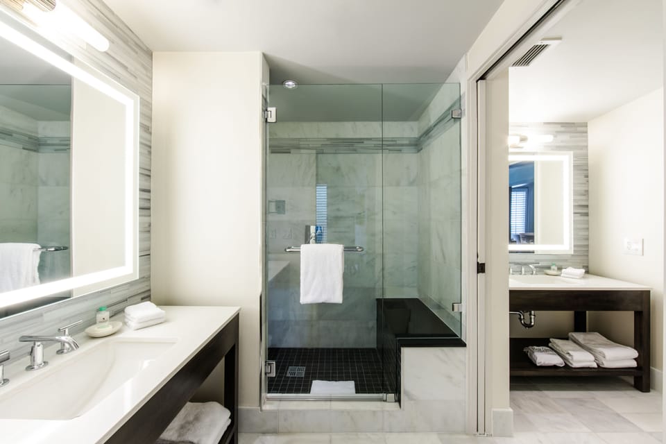 Shower, rainfall showerhead, designer toiletries, hair dryer