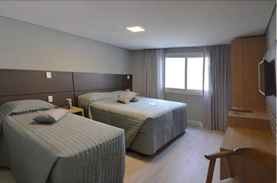 Deluxe Triple Room | Minibar, desk, blackout drapes, soundproofing