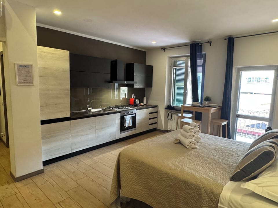 Family Quadruple Room, Kitchenette | In-room safe, desk, soundproofing, free WiFi