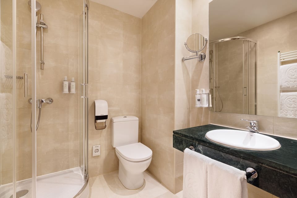 Eco-friendly toiletries, hair dryer, towels, soap