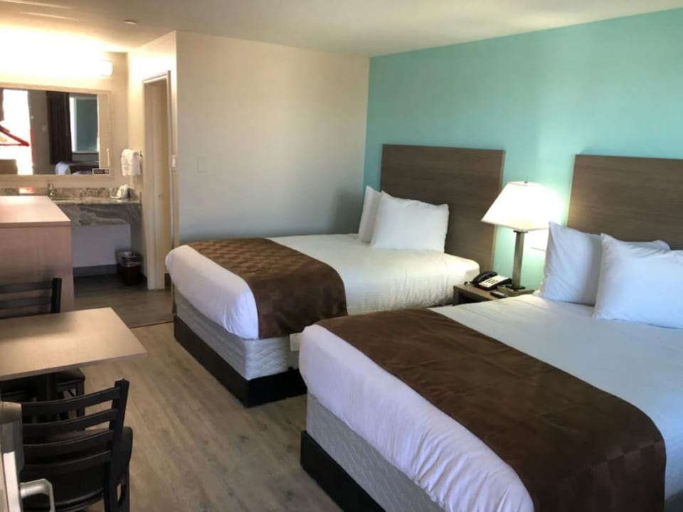 Double Full Beds | Desk, blackout drapes, WiFi (free), bed sheets