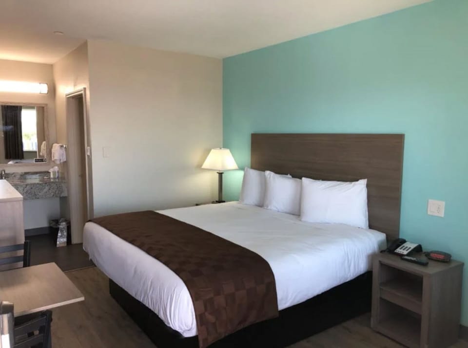 Desk, blackout drapes, WiFi (free), bed sheets