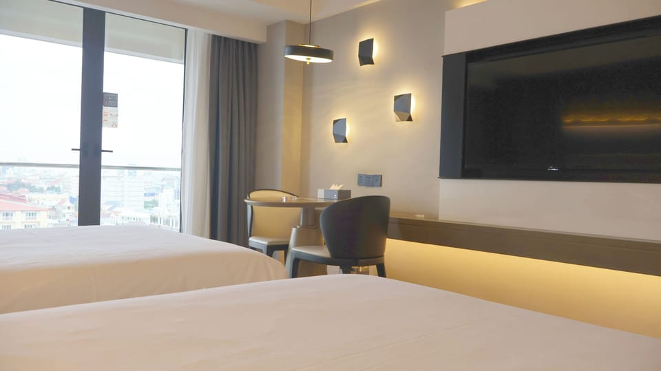 Deluxe Twin Room With City View | In-room safe, desk, laptop workspace, free WiFi