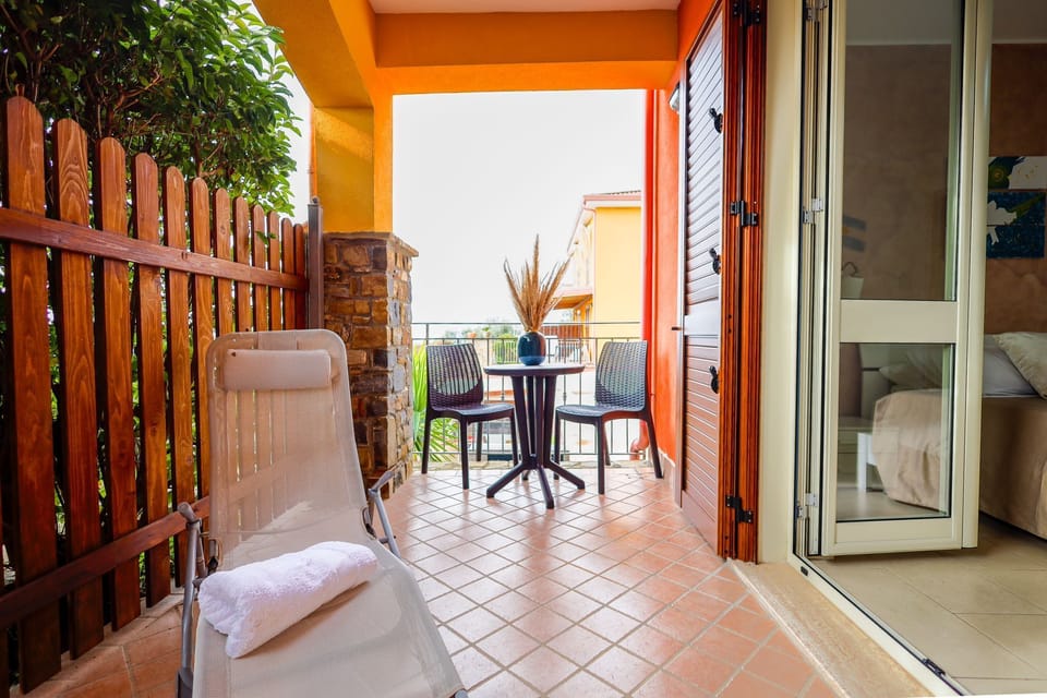 Double Room, Terrace, Sea View | In-room safe, desk, WiFi (free), bed sheets