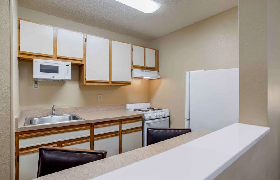 Fridge, microwave, stovetop, coffee/tea maker