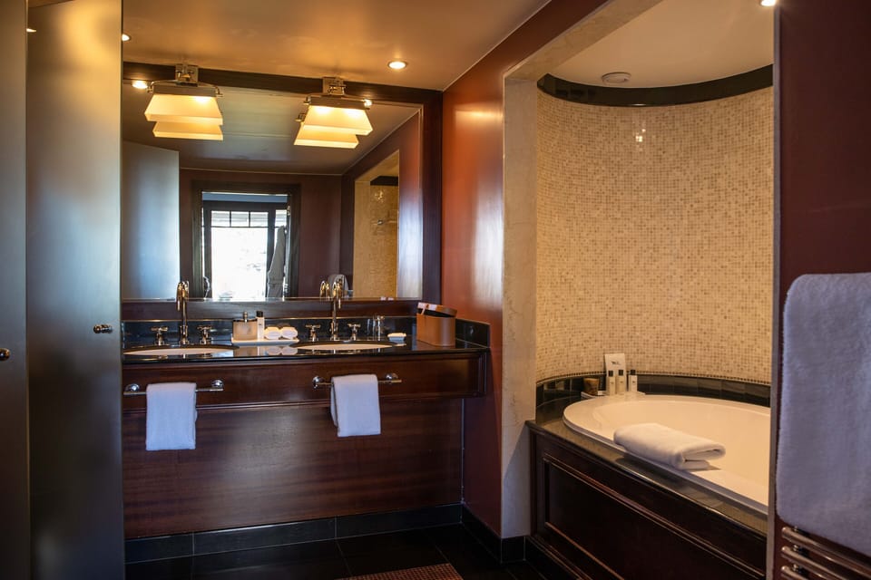 Suite, 1 King Bed (Lake) | Bathroom | Combined shower/tub, eco-friendly toiletries, hair dryer, bathrobes