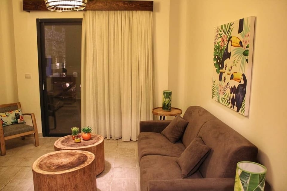 Family Suite | Living area | 41-inch LED TV with satellite channels, TV