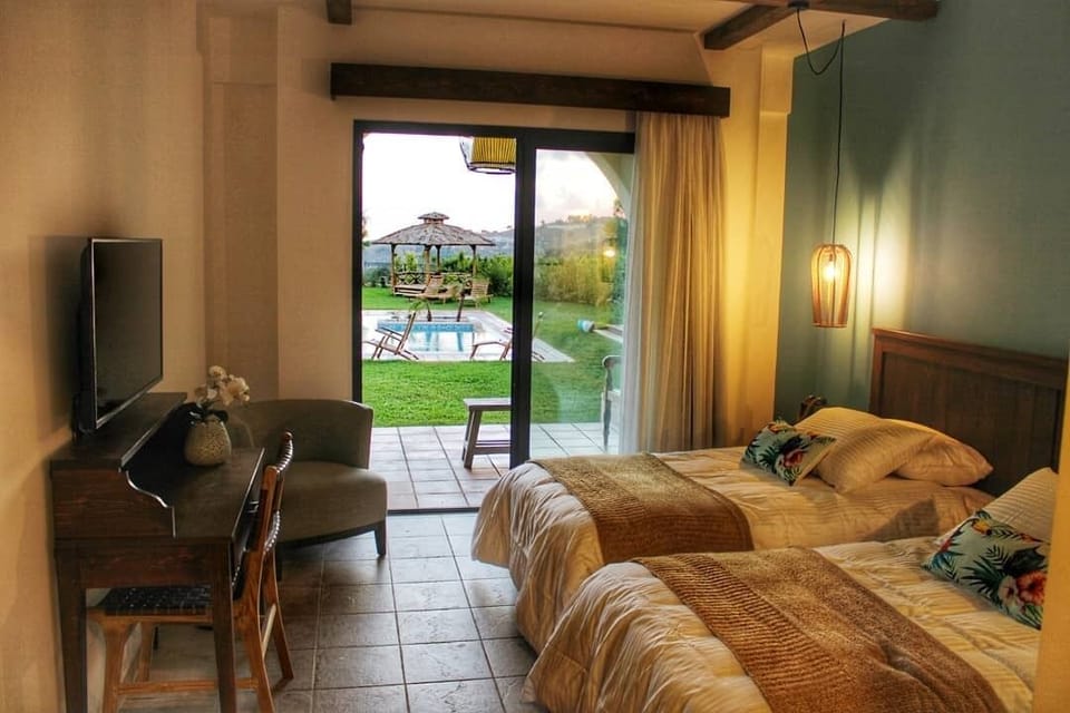 Comfort Double or Twin Room, Pool View | Minibar, in-room safe, desk, iron/ironing board
