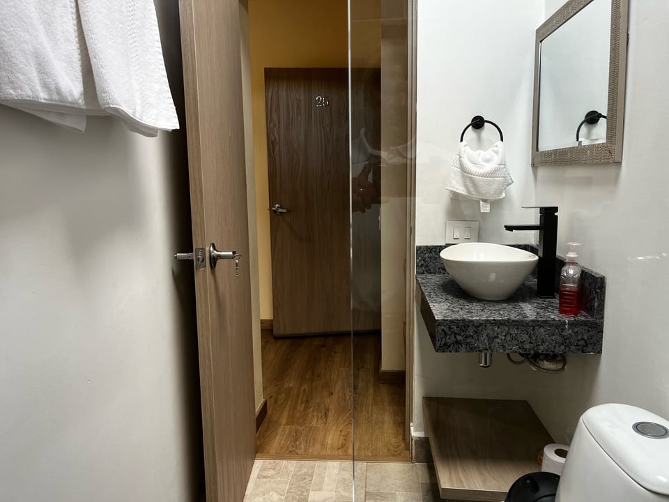 Superior Room, 1 King Bed | Bathroom | Shower, designer toiletries, towels, soap