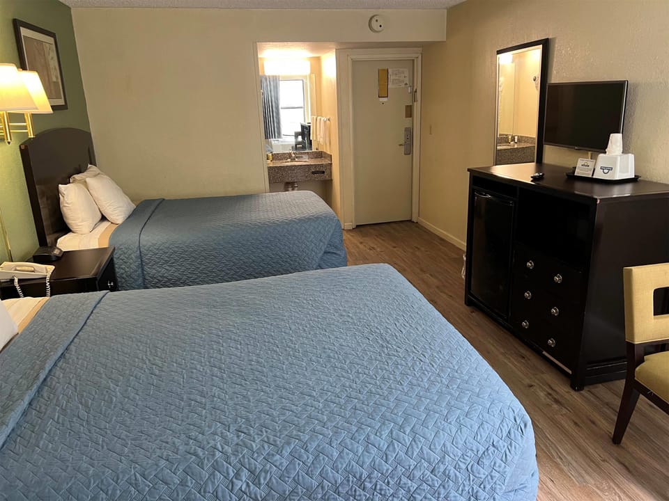 Standard Room, 2 Queen Beds | In-room safe, desk, laptop workspace, iron/ironing board