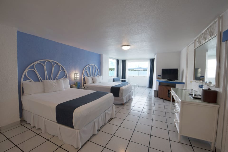 Suite, 2 Double Beds, Lake View | Minibar, in-room safe, cribs (surcharge), rollaway beds (surcharge)