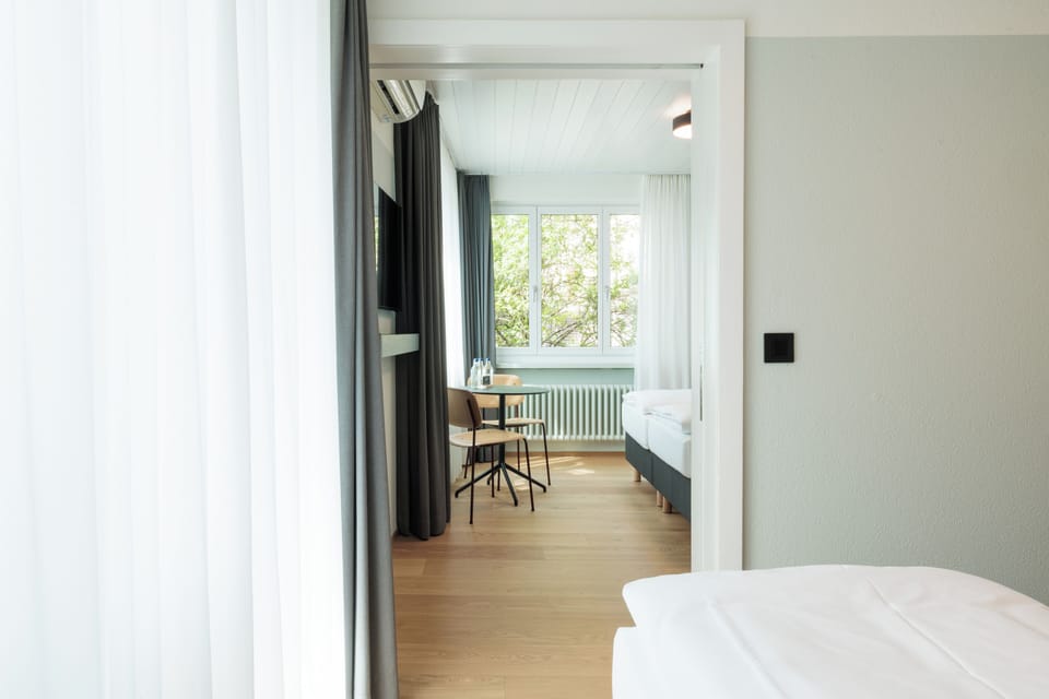 Family Suite, City View | Premium bedding, down comforters, in-room safe, desk
