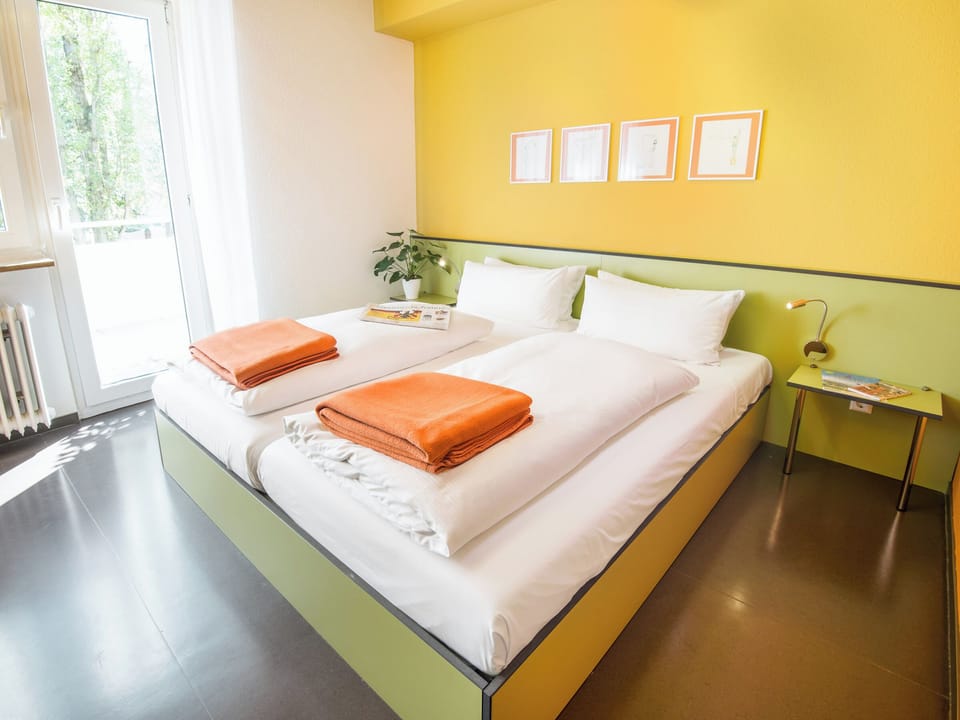 Hypo-allergenic bedding, down comforters, desk, laptop workspace
