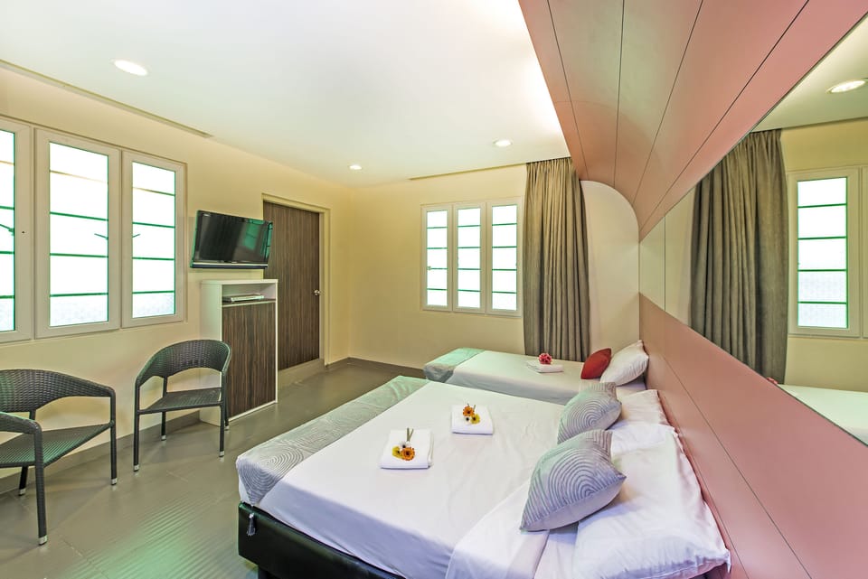 Triple Room | Blackout drapes, WiFi (free), bed sheets