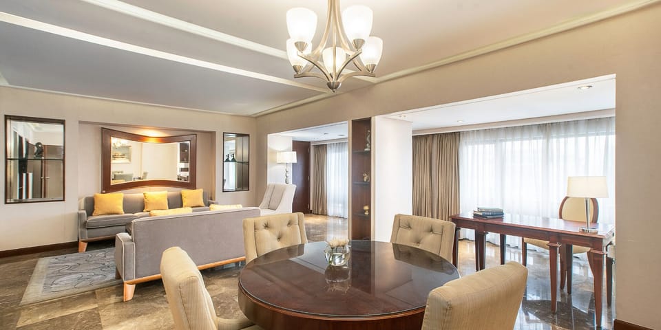 Ambassador Suite | Living area | 26-inch Smart TV with satellite channels, TV