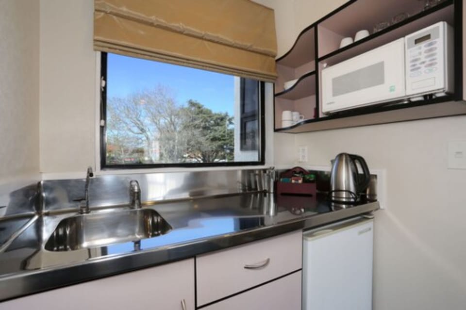 Mini-fridge, microwave, electric kettle, toaster