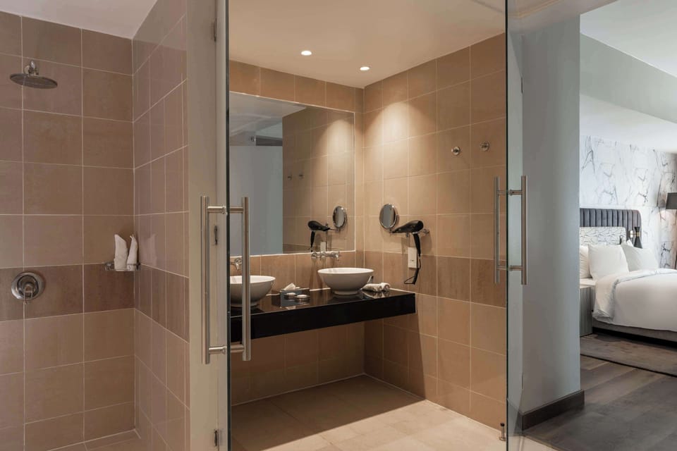 Separate tub and shower, rainfall showerhead, free toiletries