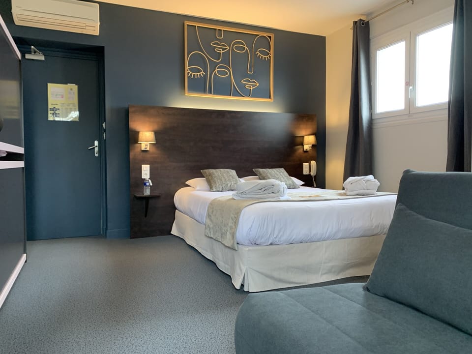 Family Quadruple Room | Minibar, in-room safe, individually decorated, desk