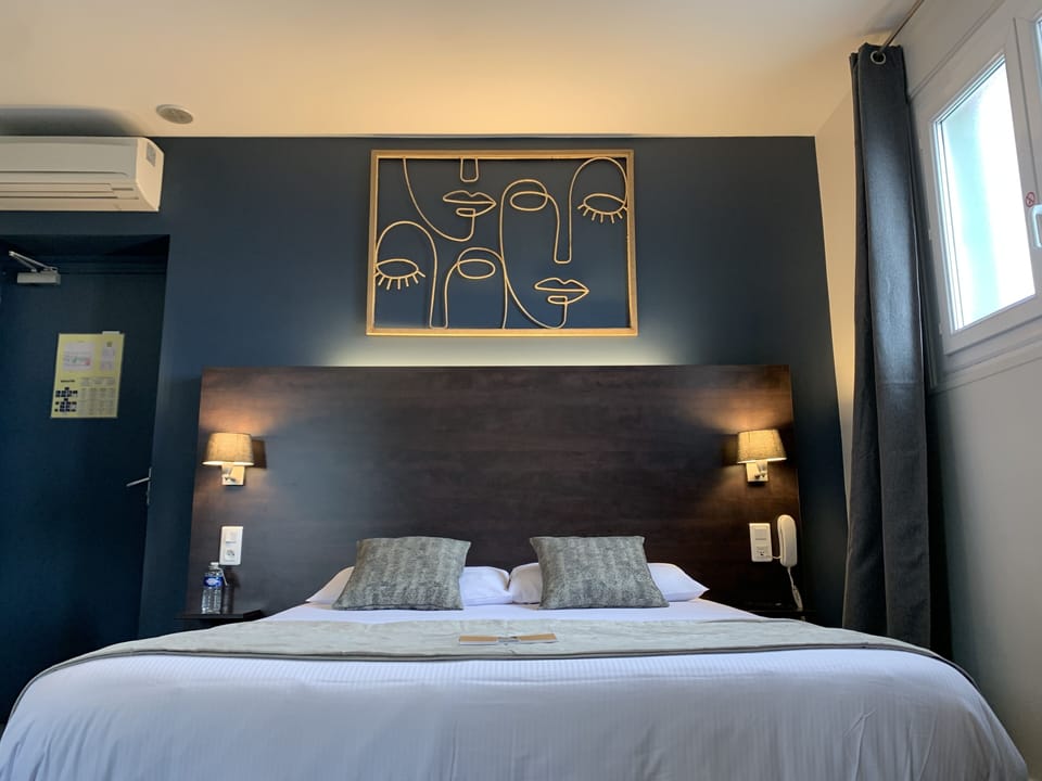 Family Quadruple Room | Minibar, in-room safe, individually decorated, desk