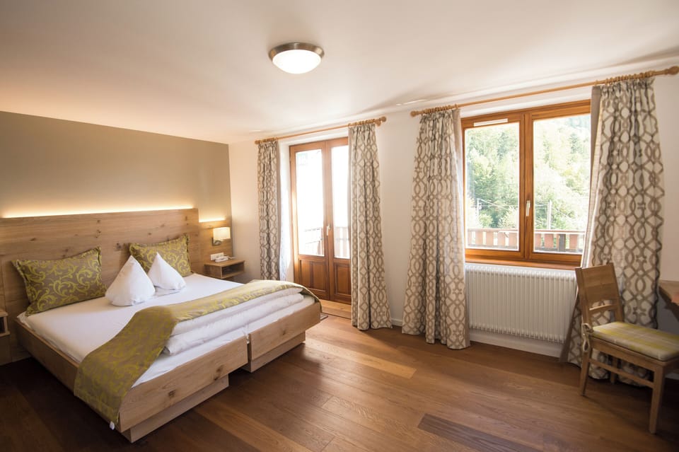 Family Triple Room | Desk, blackout drapes, WiFi (free), bed sheets