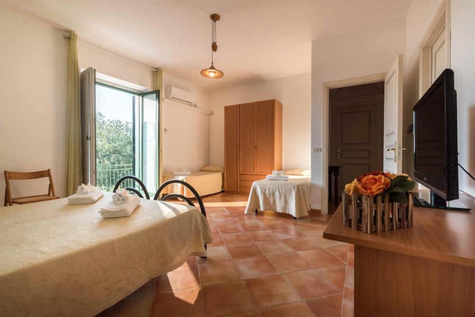 Quadruple Room, Sea View | Desk, free WiFi, bed sheets