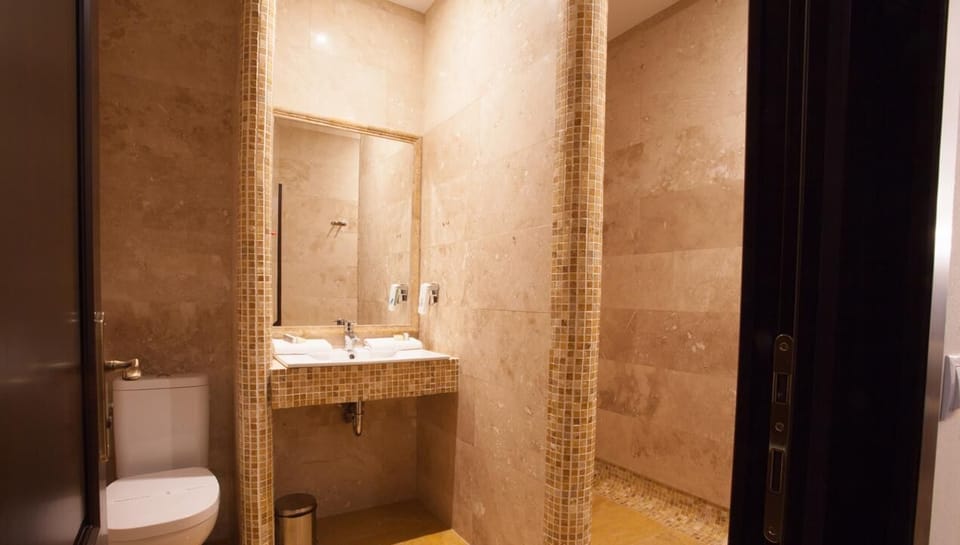 Shower, free toiletries, hair dryer, slippers