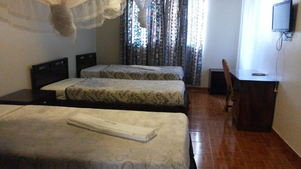 Family Room | Premium bedding, individually decorated, desk, blackout drapes