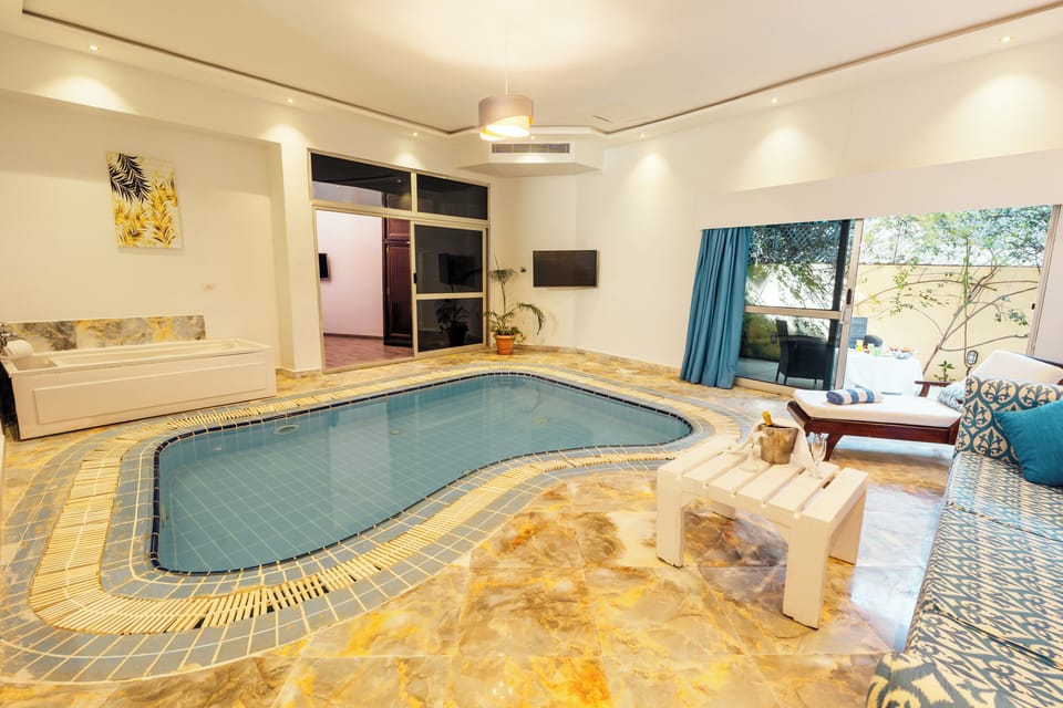 Indoor pool, outdoor pool, pool umbrellas, sun loungers
