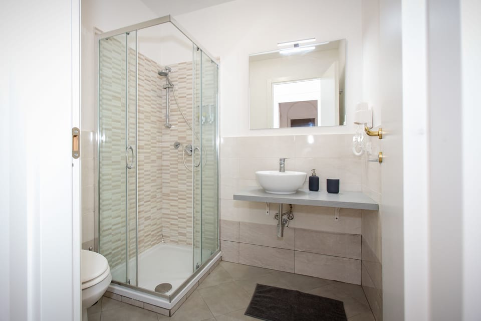 Shower, free toiletries, hair dryer, towels