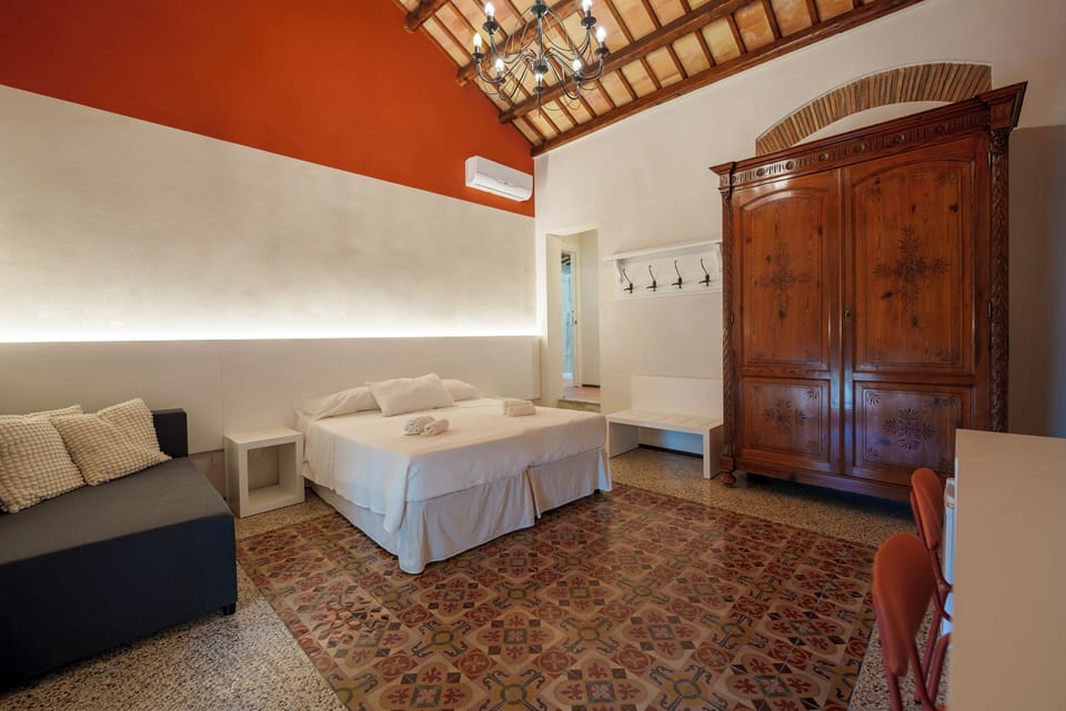 Deluxe Triple Room | Minibar, laptop workspace, blackout drapes, free WiFi