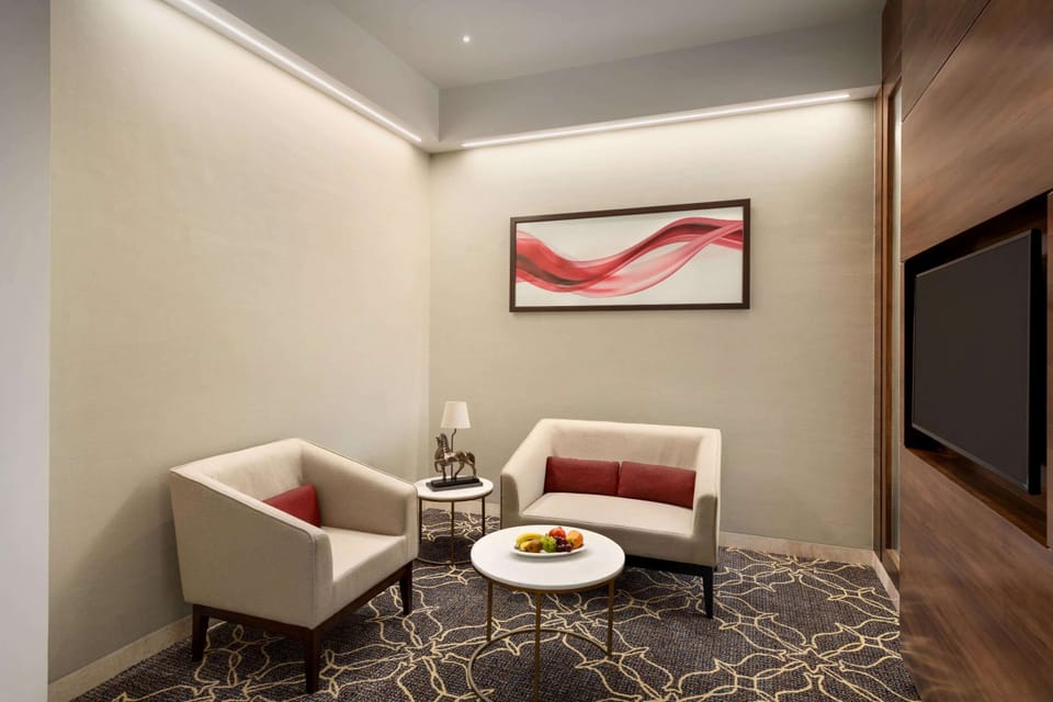 Suite, 1 King Bed, Non Smoking | Minibar, in-room safe, individually furnished, desk