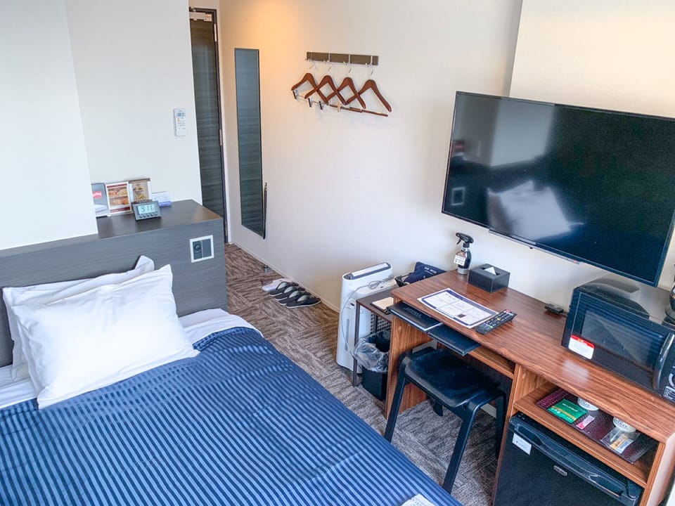 Desk, laptop workspace, free WiFi, bed sheets