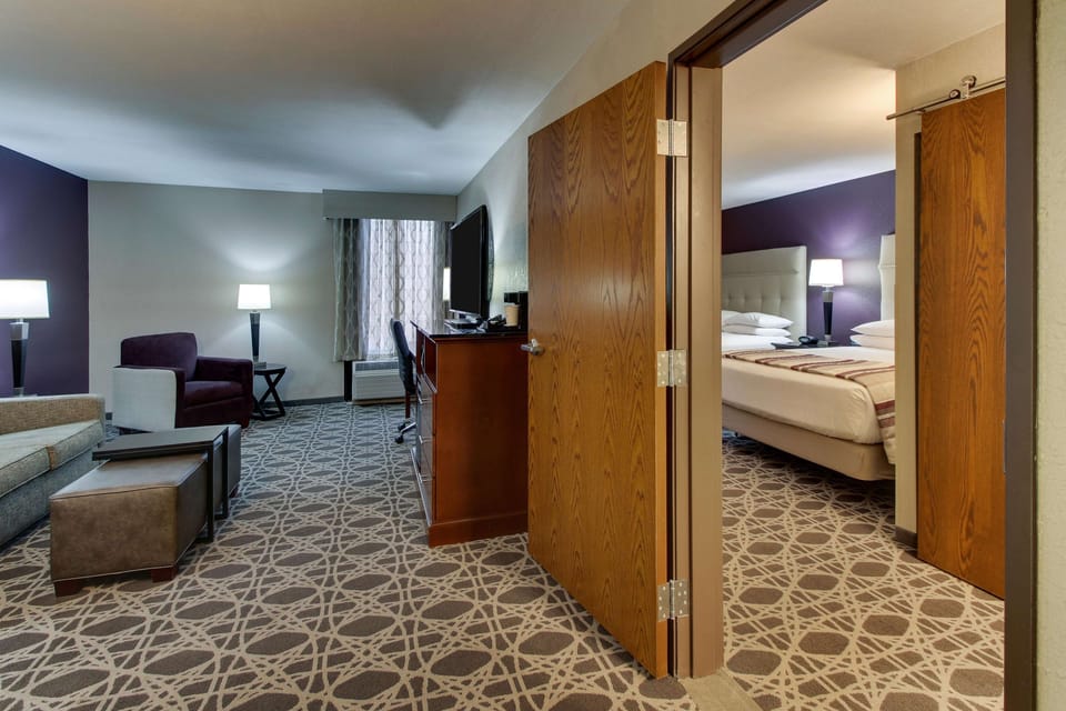 Suite, 2 Queen Beds, Accessible (Sofa Sleeper, Tub, 2 Rooms) | Desk, blackout drapes, iron/ironing board, free cribs/infant beds