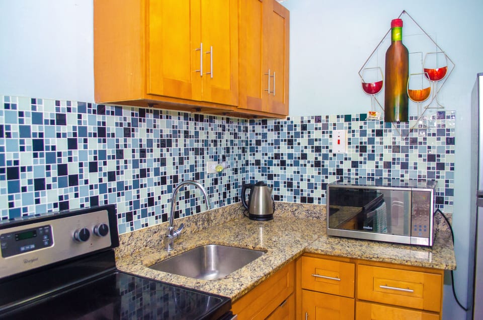 Apartment, Non Smoking | Private kitchen | Full-size fridge, microwave, oven, stovetop
