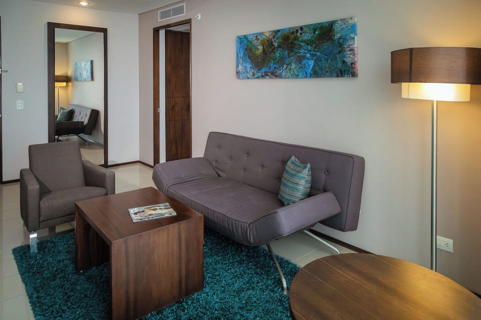 Deluxe Room, 1 King Bed | Living area | 32-inch LCD TV with cable channels, TV