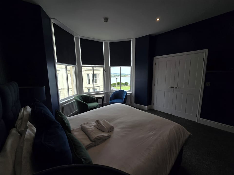 Double Room (Bay View Suite) | Blackout drapes, iron/ironing board, free WiFi, bed sheets