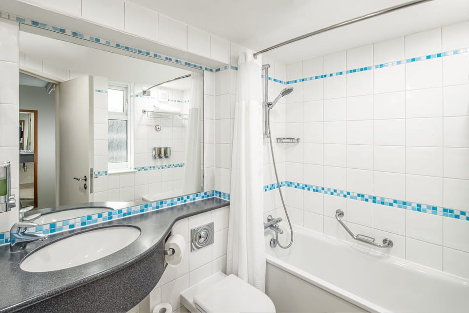 Standard Room, Multiple Beds | Bathroom | Combined shower/tub, eco-friendly toiletries, hair dryer, towels