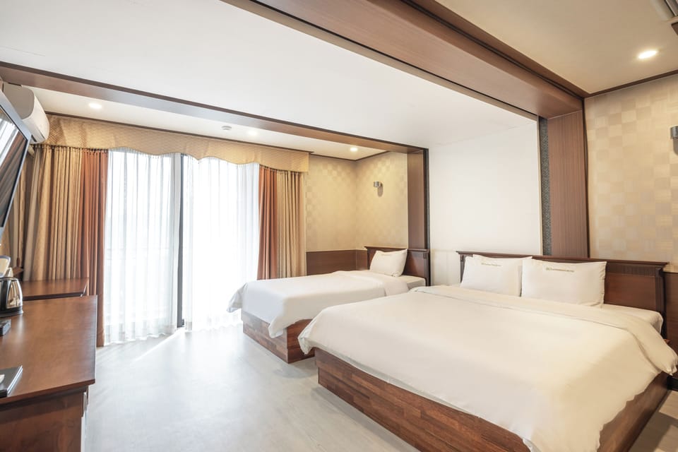 Standard Twin Room (Hot Spring Water) - Rate for 2, Extra Charges Apply | Blackout drapes, iron/ironing board, free WiFi, bed sheets