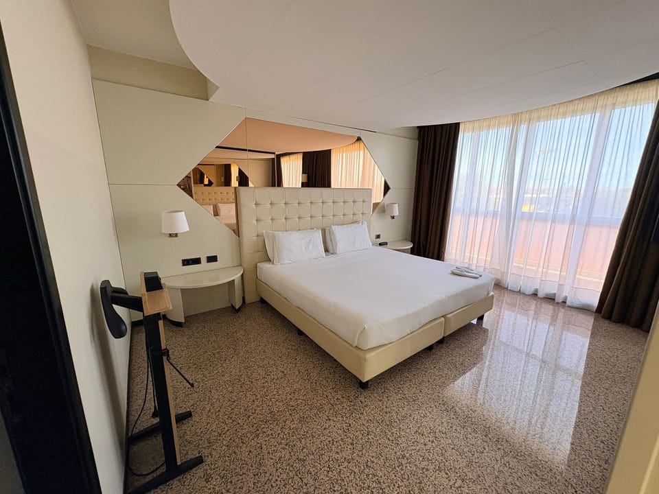 Family Quadruple Room | Minibar, in-room safe, desk, laptop workspace