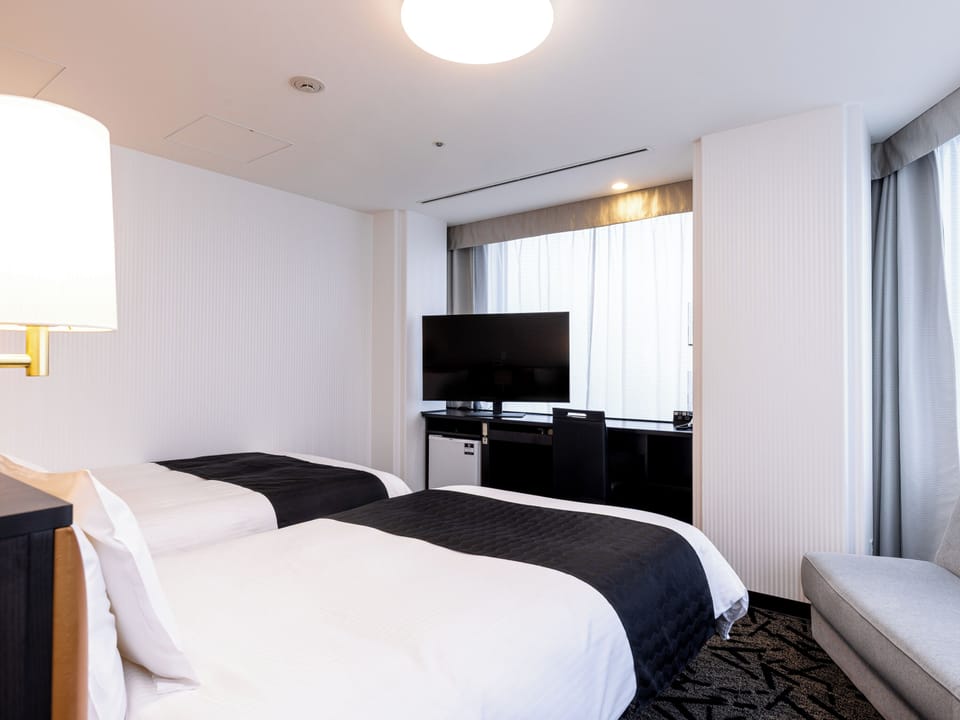 Deluxe Twin Room, 2 Twin Beds, Non Smoking (Please refer Hotel Policy for Child fee details) | Down comforters, desk, free WiFi, bed sheets