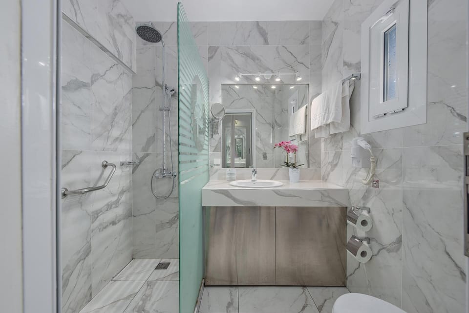 Shower, rainfall showerhead, eco-friendly toiletries, hair dryer