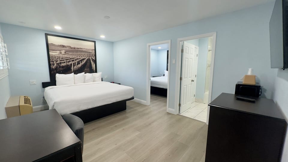 Suite, 2 Bedrooms | Desk, soundproofing, iron/ironing board, free WiFi