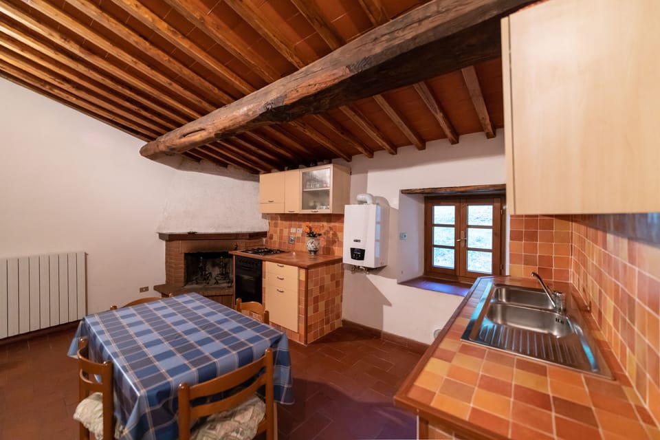 Apartment, 2 Bedrooms (Nocciolo) | Private kitchen | Full-size fridge, stovetop, highchair, cookware/dishes/utensils