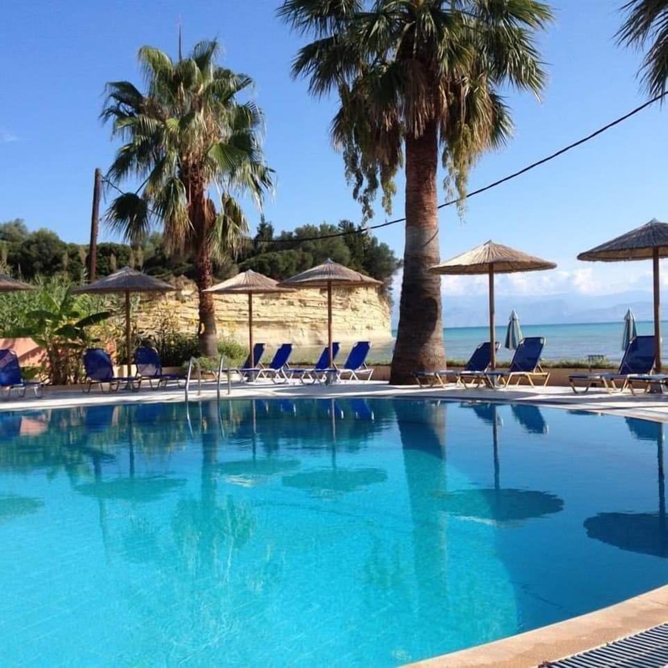 Outdoor pool, pool umbrellas, sun loungers