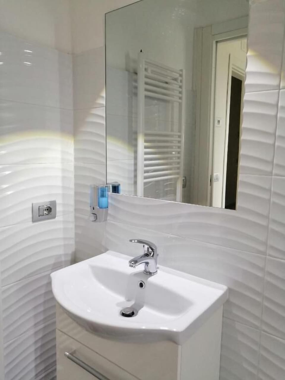 Bidet, towels, soap, toilet paper