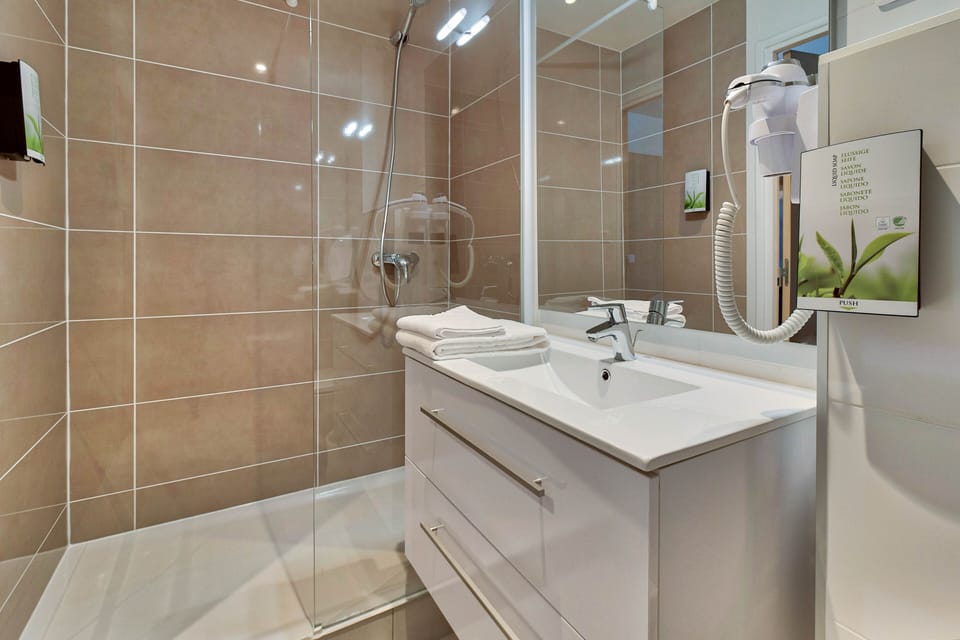 Shower, free toiletries, hair dryer, towels